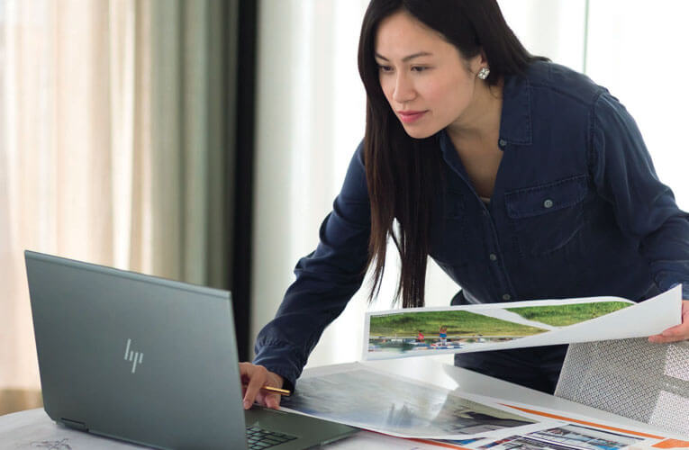 A woman using an HP laptop