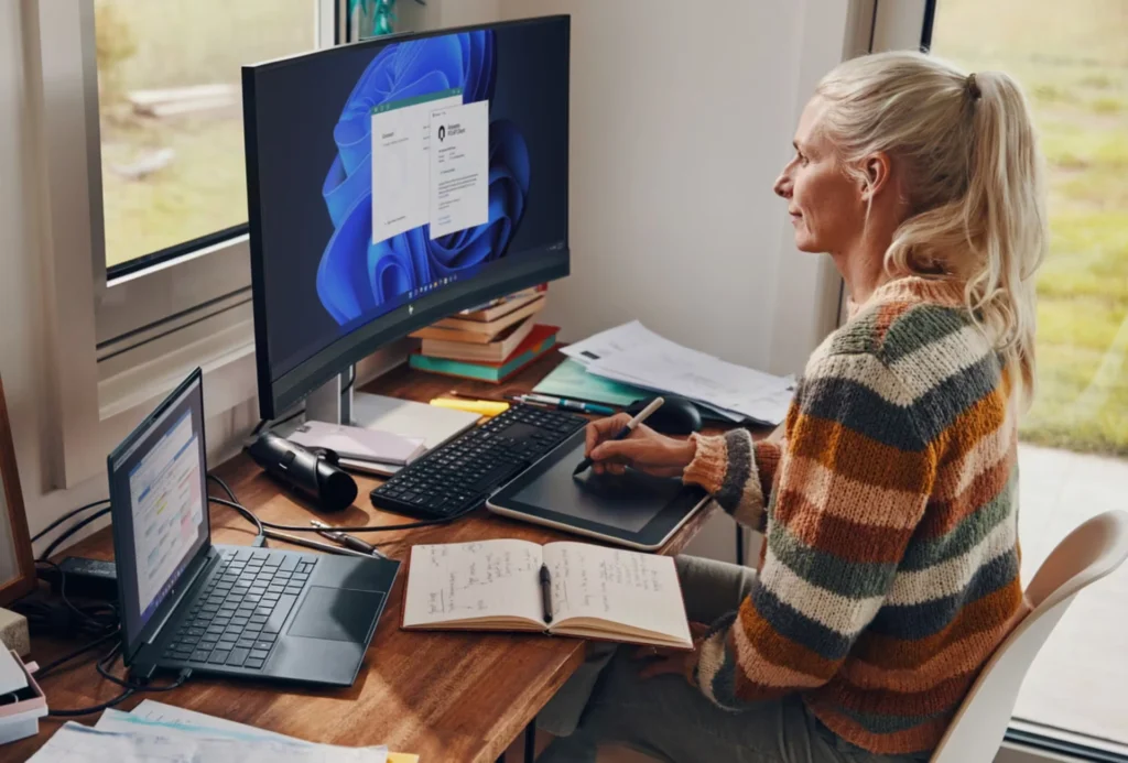 A woman using an HP desktop