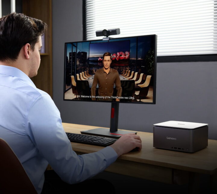 A man using a Lenovo desktop