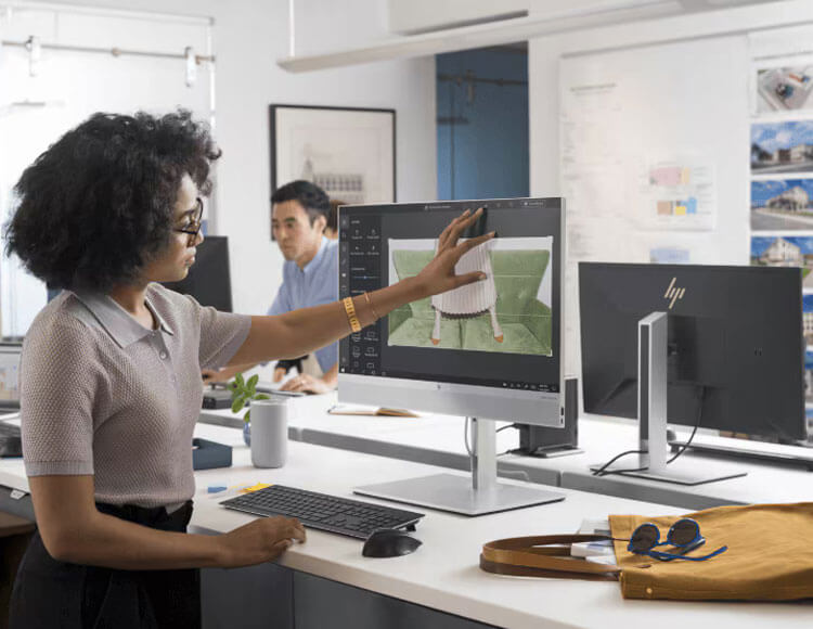 A woman in front of an HP workstation