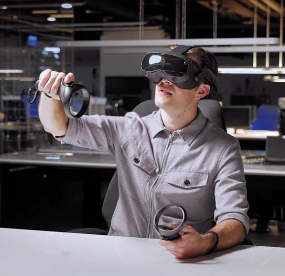 A man using a HTC Vive Focus 3 headset
