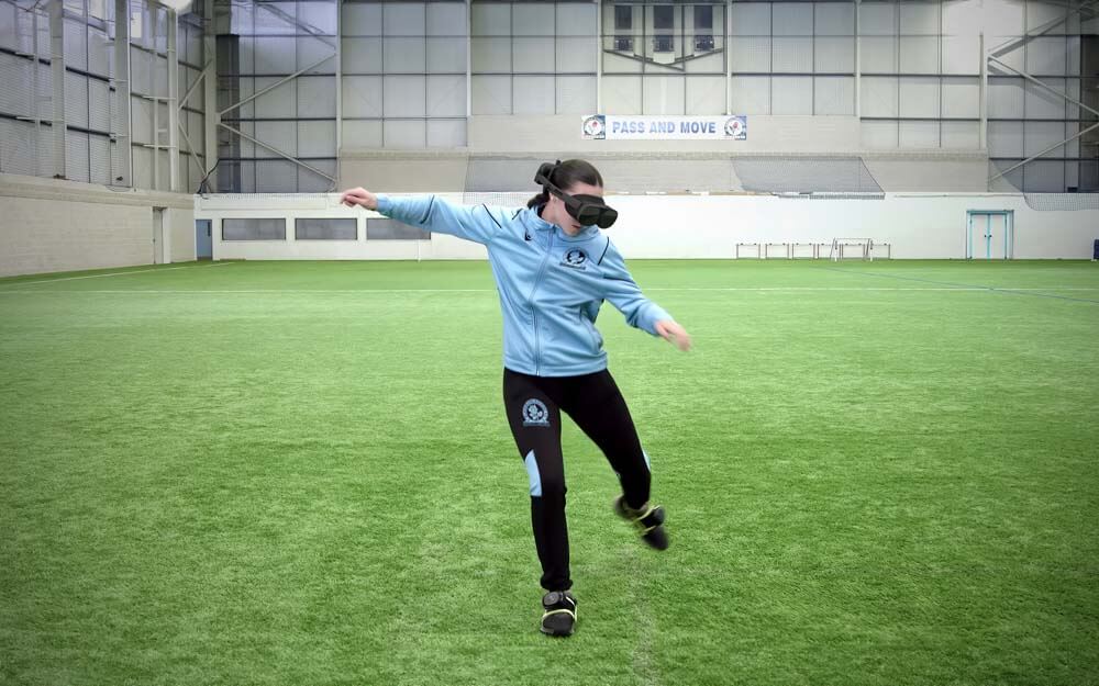 A woman using HTC Vive Ultimate Tracker