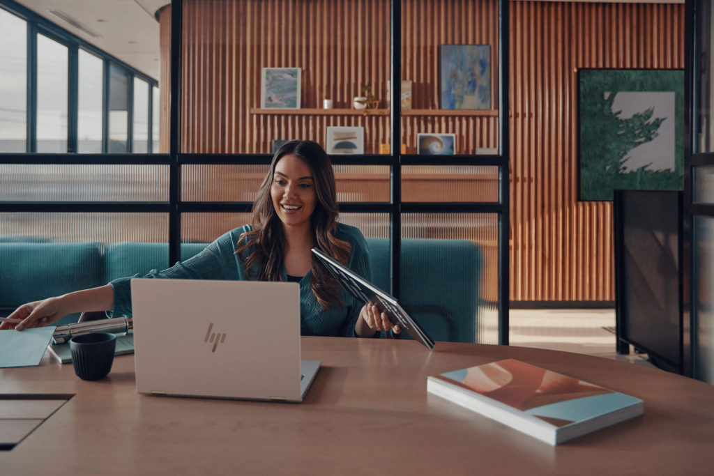 A woman using an HP laptop