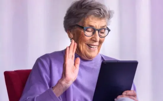 A woman using a Lenovo tablet