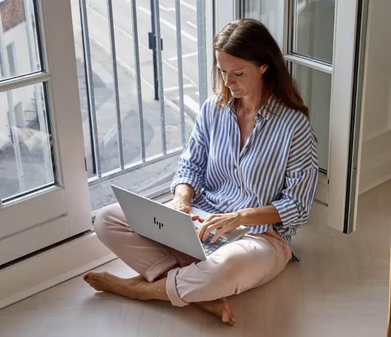 A woman using an HP laptop