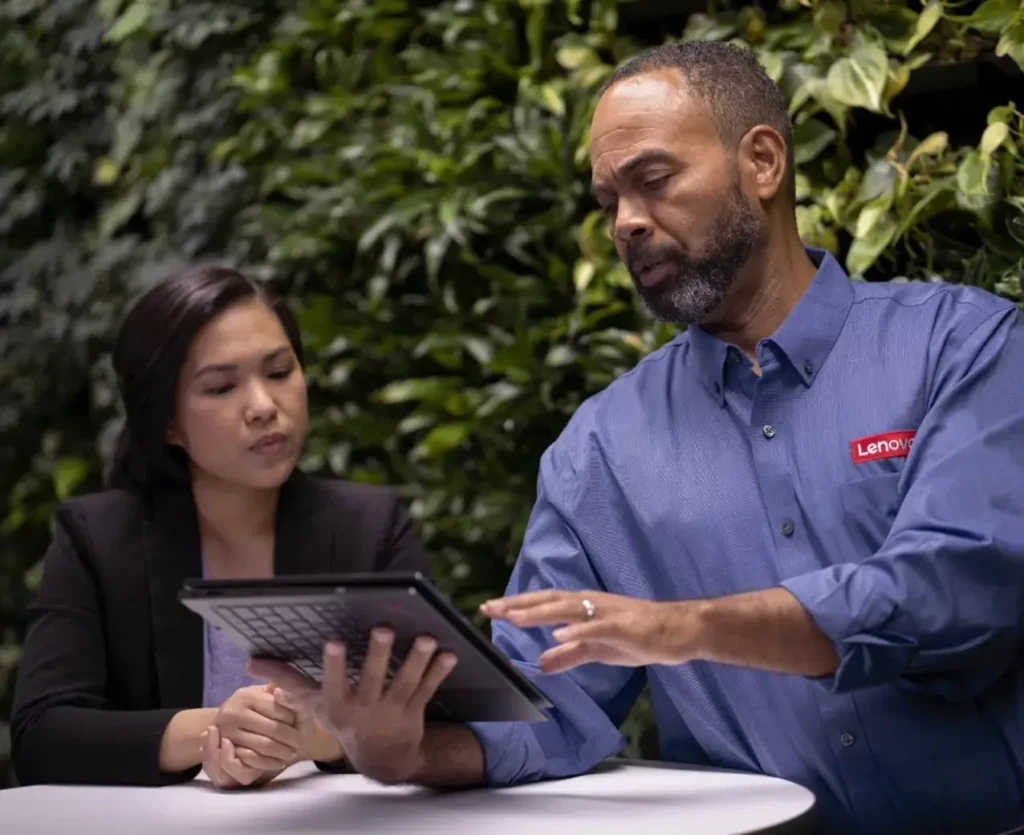 A Lenovo employee using a notebook