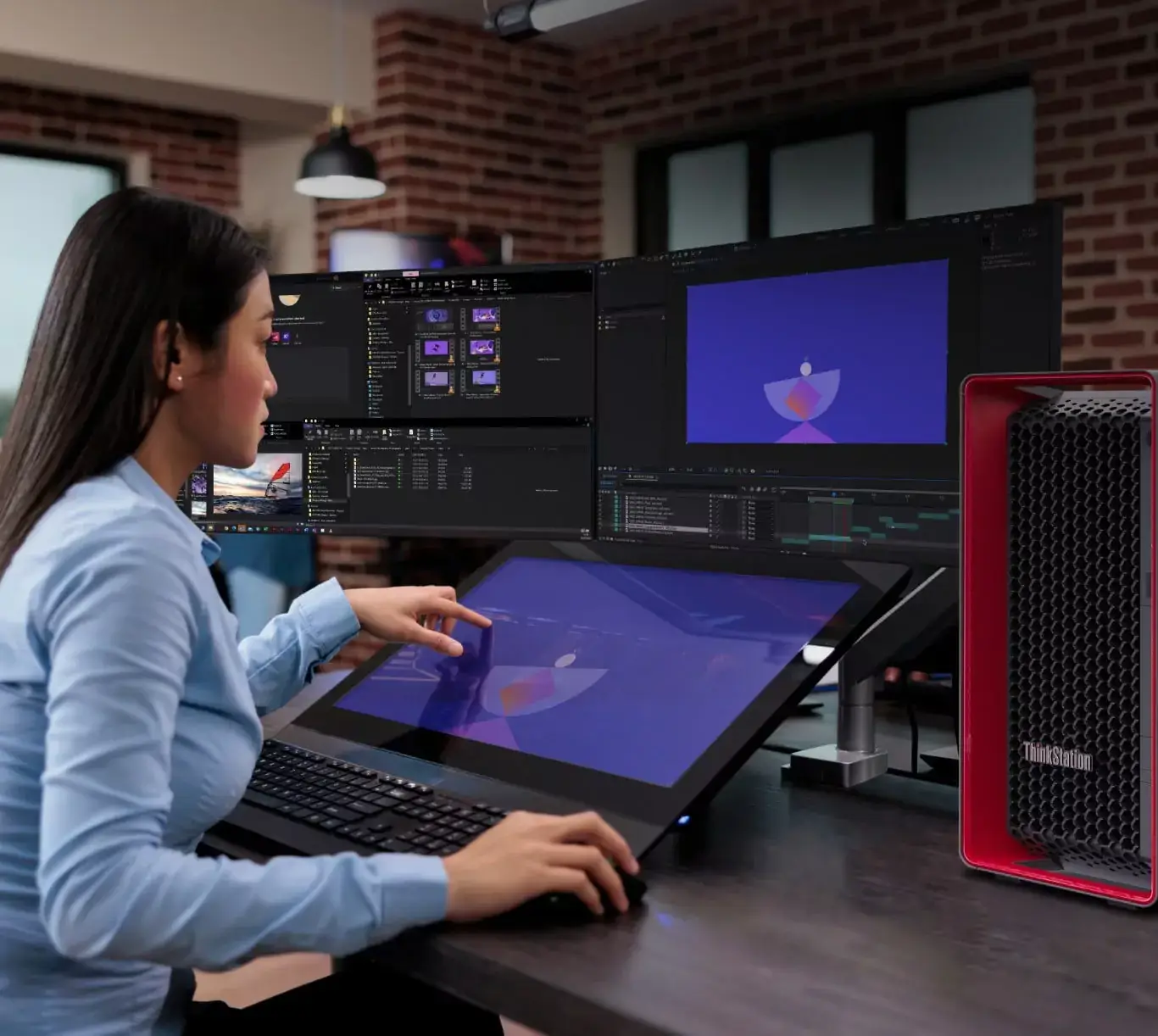 A woman using a Lenovo ThinkStation